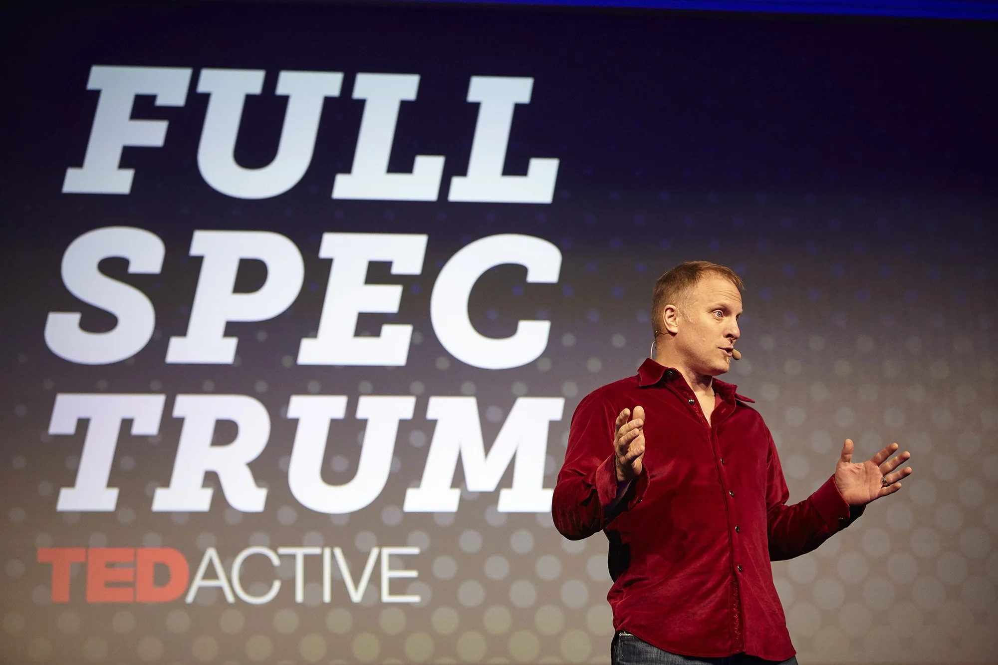 John K. Bates speaking on the TED stage