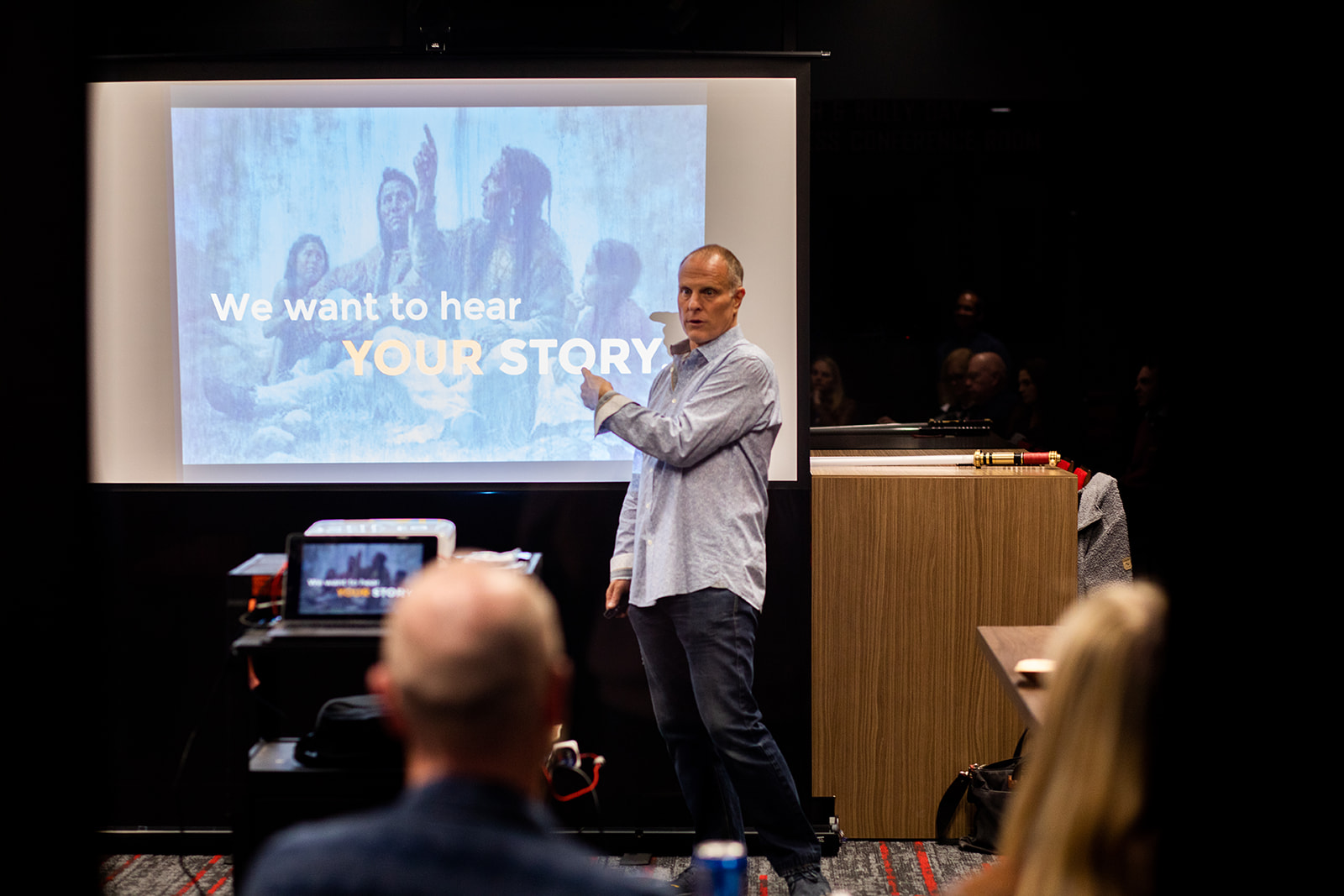 John Bates delivering a storytelling keynote to a live audience